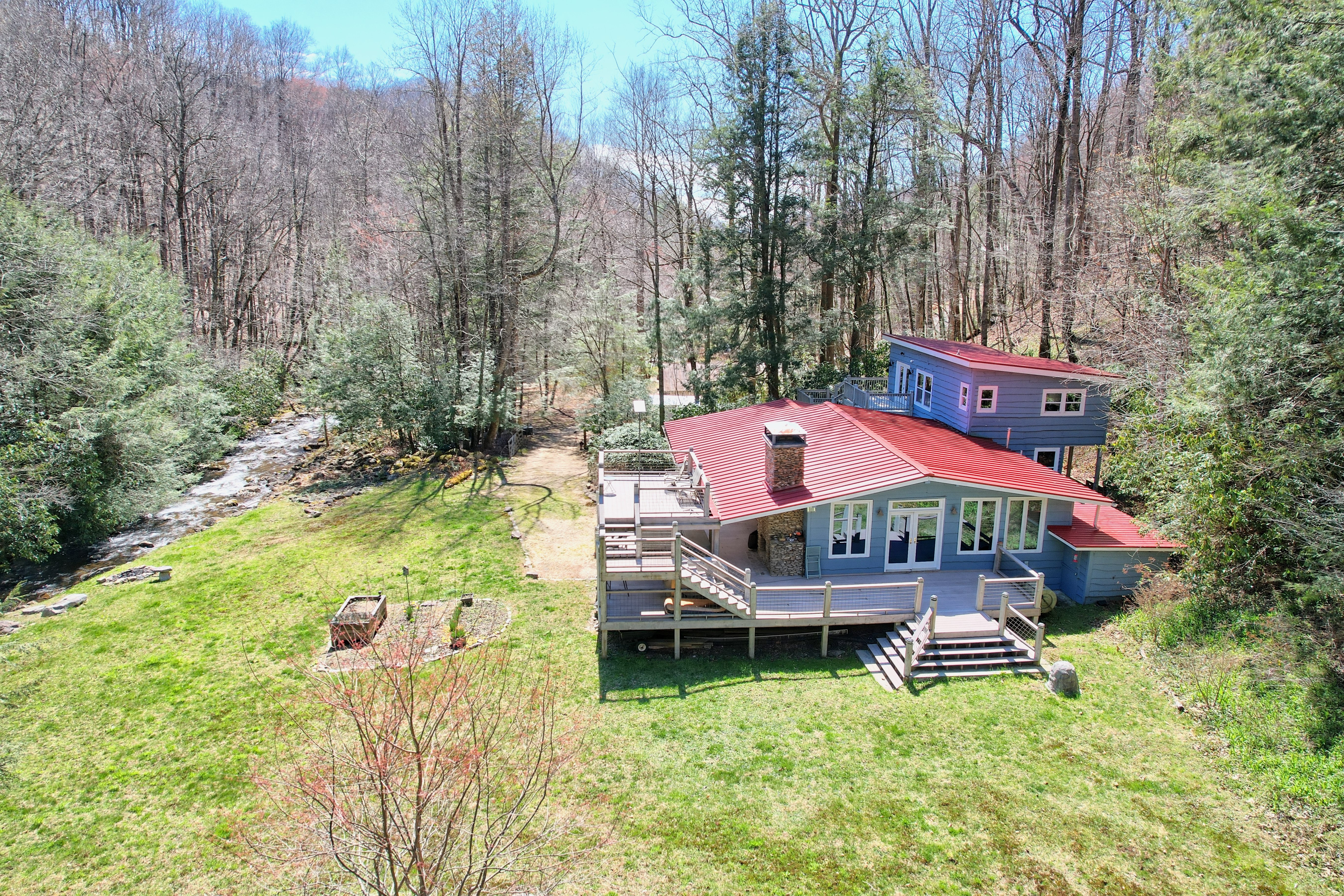 Primary hero view of the cabin and property